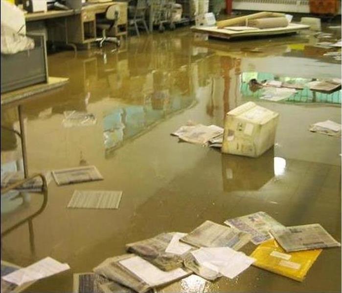 flooded muddy water, mail, and boxes on floor of facility