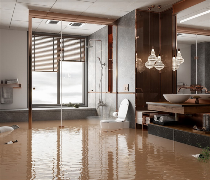 a flooded bathroom with furniture floating everywhere